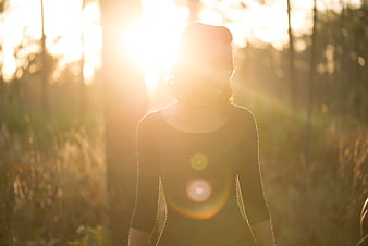 Woman Silhouette in Golden Forest Sunlight
