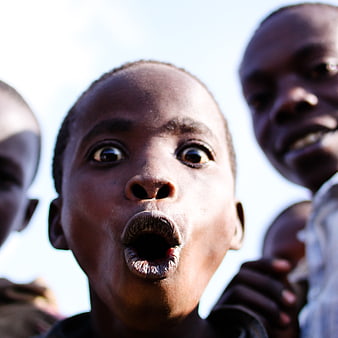 Close-up portrait of a surprised African child with wide eyes