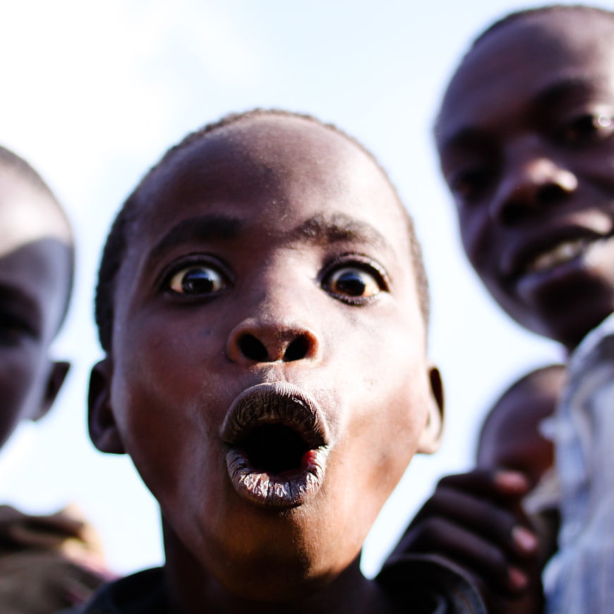 Close-up portrait of a surprised African child with wide eyes