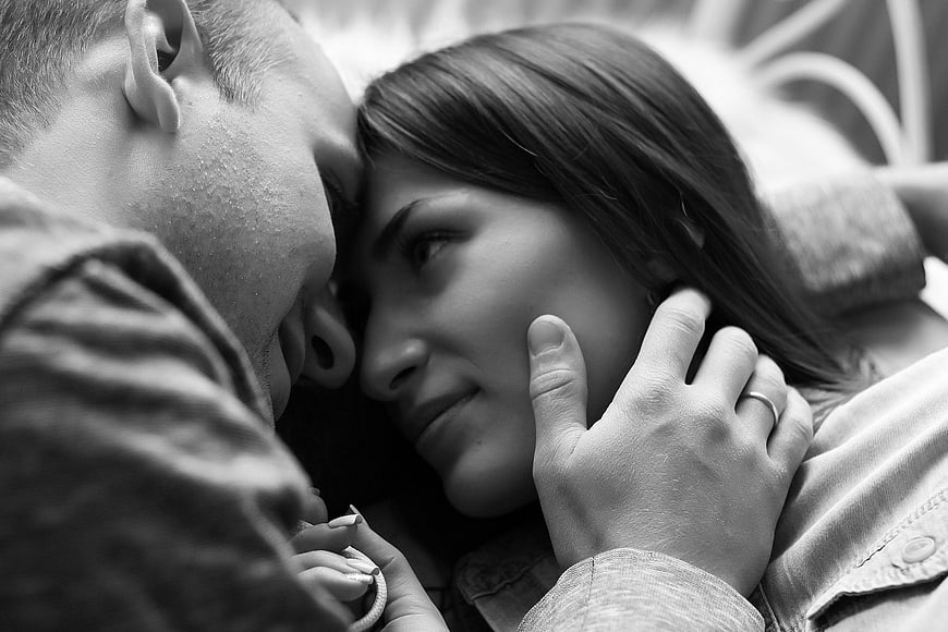 Intimate black and white portrait of a loving couple embracing