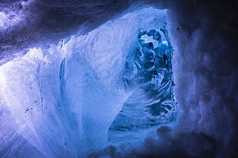 Blue Ice Cavern Interior With Frozen Textures And Natural Light