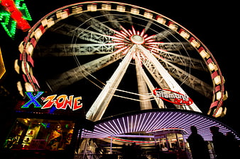 Illuminated Ferris Wheel at Night Carnival Fairground