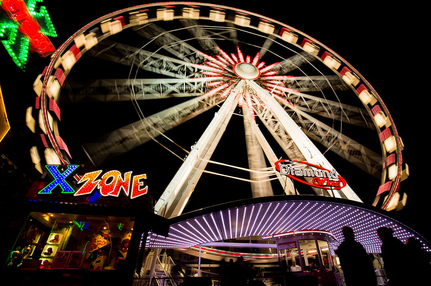 Illuminated Ferris Wheel at Night Carnival Fairground