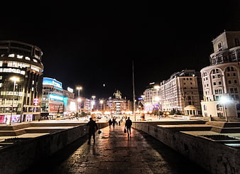 Night view of Republic Square in Yerevan with people walking