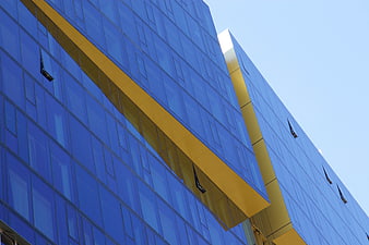Modern Blue Glass Building with Gold Accents