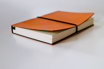 Orange Leather Notebook on White Background