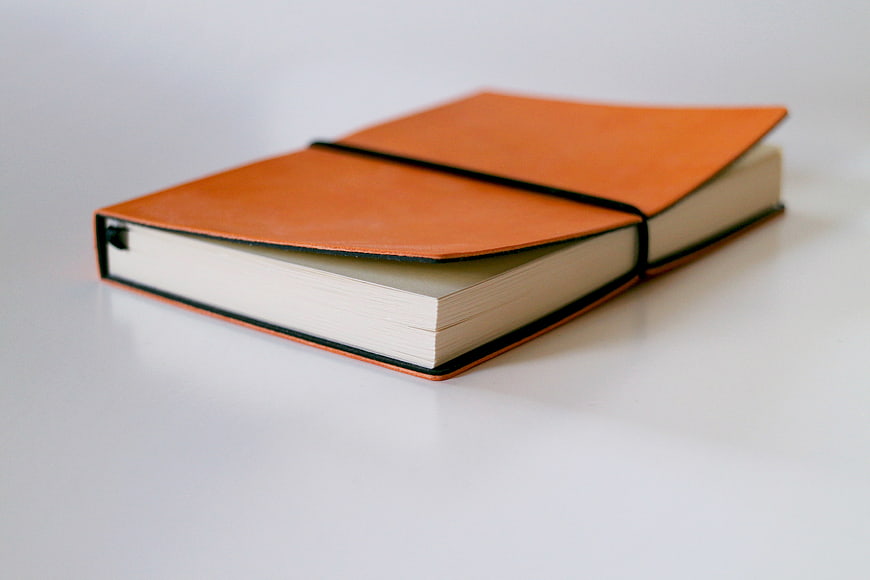 Orange Leather Notebook on White Background
