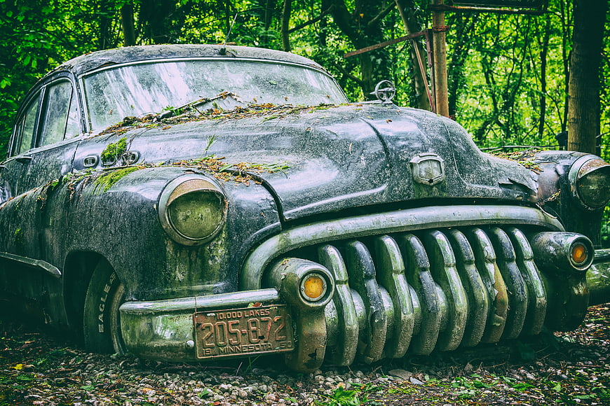 Abandoned Vintage Buick Car Rusted In Forest