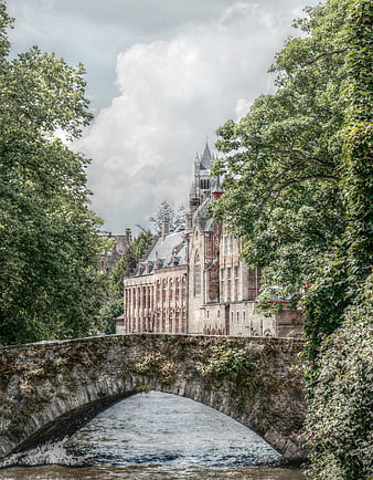 Historic Stone Bridge Over Canal in Bruges, Belgium