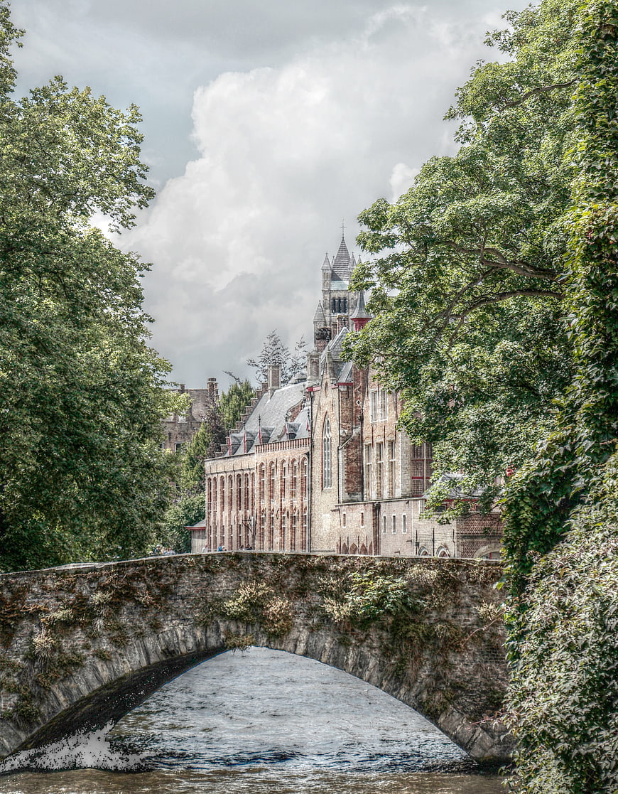 Historic Stone Bridge Over Canal in Bruges, Belgium