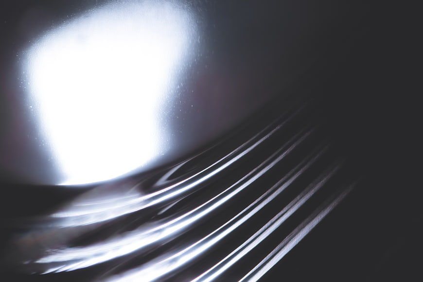 Abstract chrome metal texture with light reflection