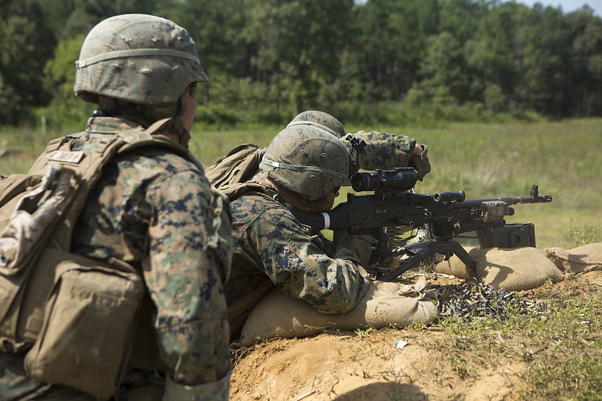 Marines firing machine gun during military training exercise