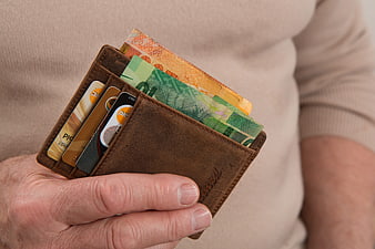 Senior Man Holding Leather Wallet with Cash and Credit Cards