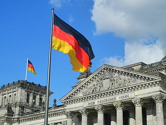 German Flag Flying Over Reichstag Building in Berlin