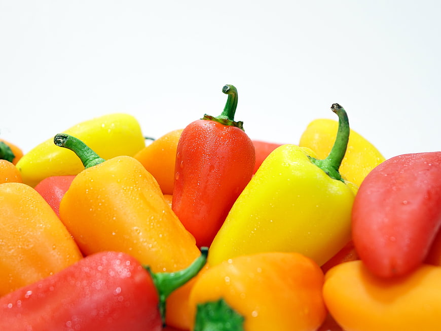 Fresh Colorful Bell Peppers with Water Droplets on White Background