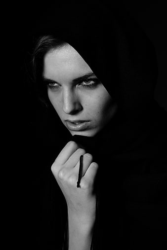 Dramatic Black and White Portrait of a Woman in a Hood