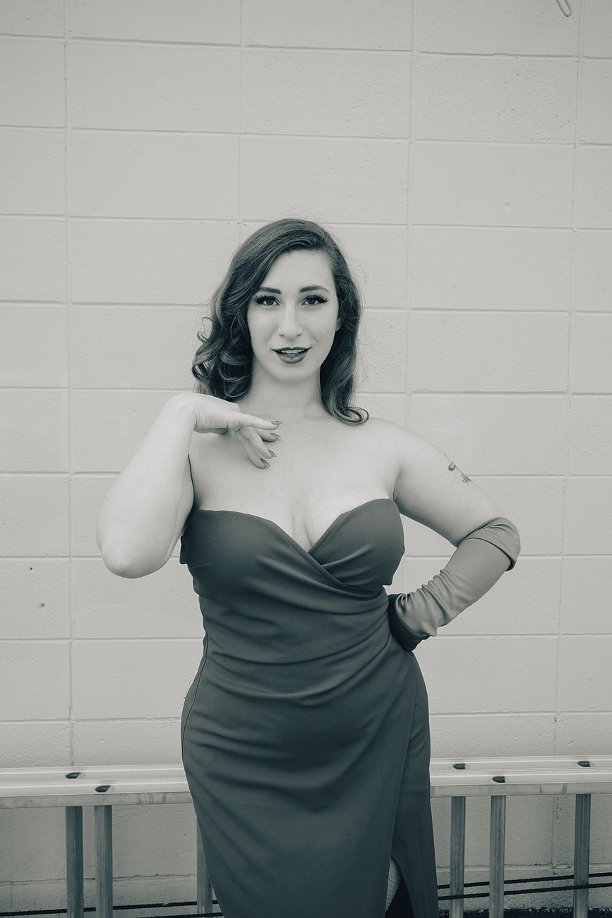 Vintage Style Woman in Strapless Dress and Gloves