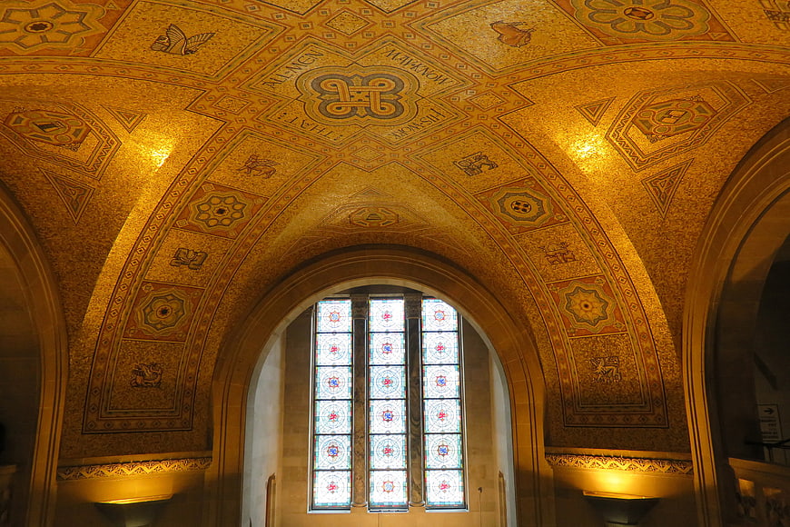 Ornate Byzantine gold mosaic ceiling with stained glass window