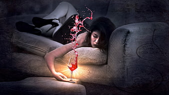 Woman sleeping on sofa with glowing red wine splash