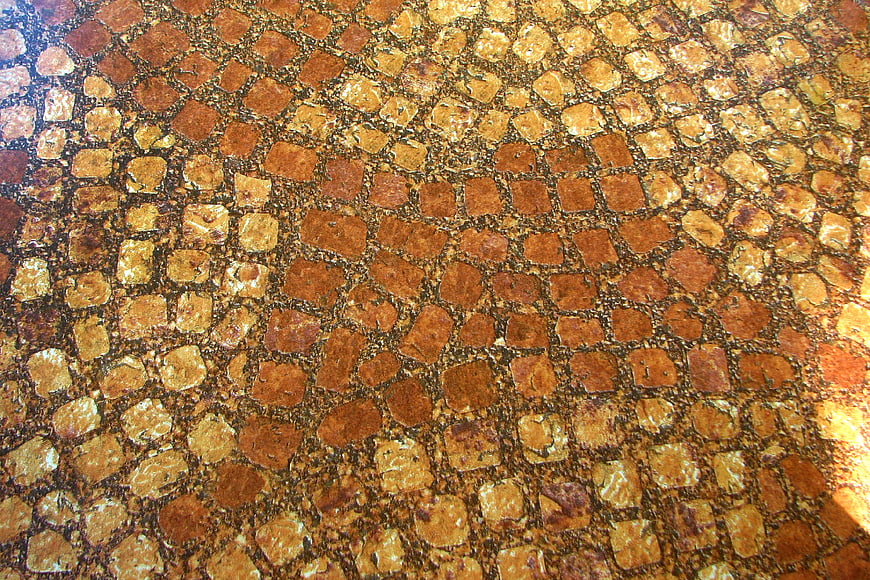 Close-up of textured brown and tan mosaic tile pattern