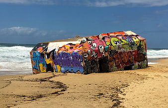 Colorful Graffiti on Sunken WWII Bunker at Beach