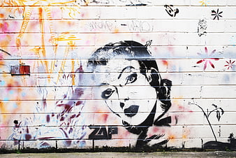 Vintage Audrey Hepburn Graffiti on Urban Brick Wall