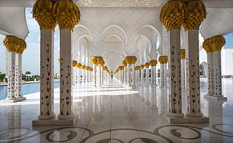 Grand Mosque Architecture with Golden Columns and Arches
