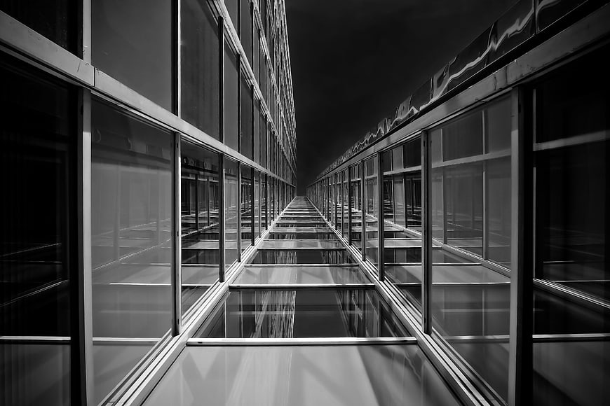 Black and White Modern Glass Building Facade with Symmetrical Perspective