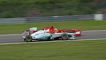 Formula 1 Race Cars Overtaking on Track