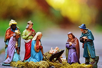 Outdoor Nativity Scene With Colorful Ceramic Figures And Moss
