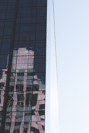 Modern Glass Building with Abstract Reflections