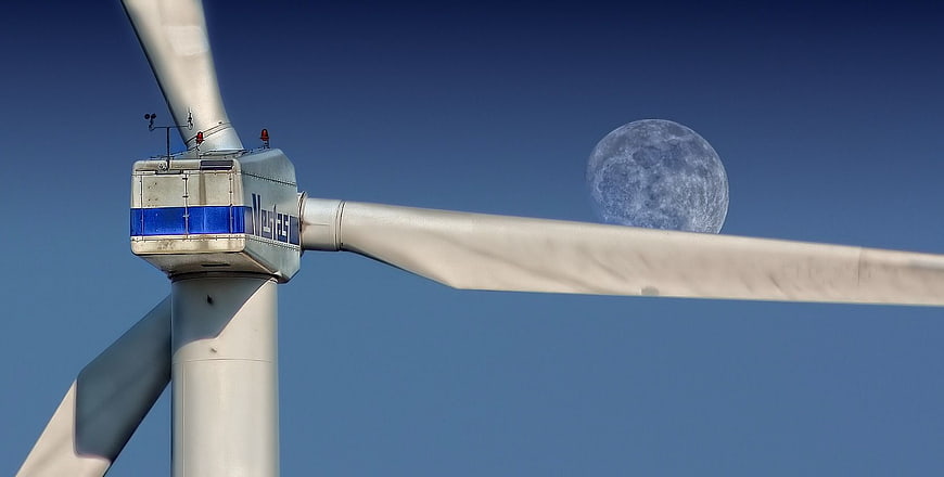 Wind Turbine Nacelle with Moon in Blue Sky