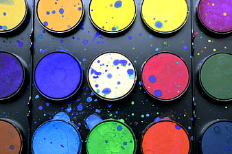 Top View of Colorful Watercolor Paint Palette with Splatters