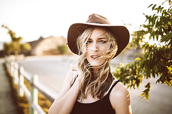 Blonde Woman in Cowboy Hat with Windblown Hair