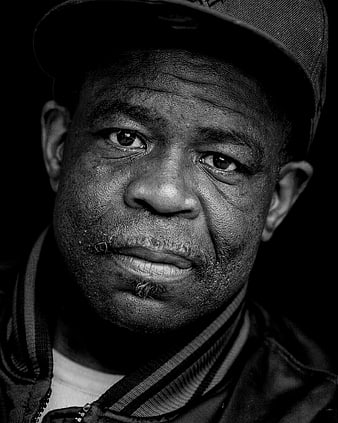 Black and white portrait of a man in a cap