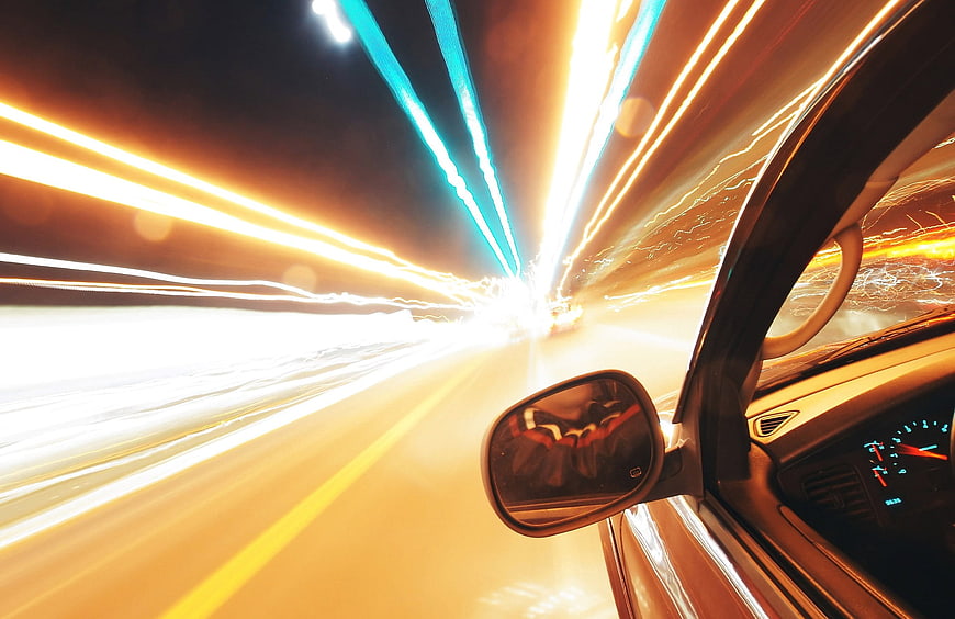 Night driving car speed light trails motion blur