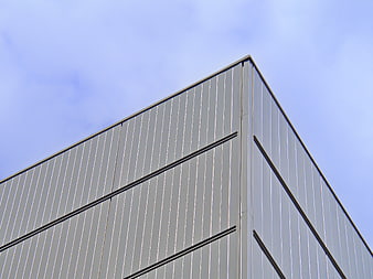 Modern industrial building facade with corrugated metal siding