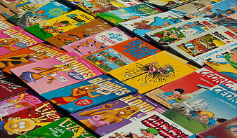 Colorful French Comic Books Arranged In A Grid Pattern