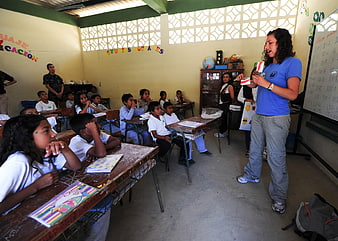 Female Teacher Teaching Math Class in Rural School