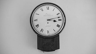 Vintage Black and White Wall Clock with Roman Numerals