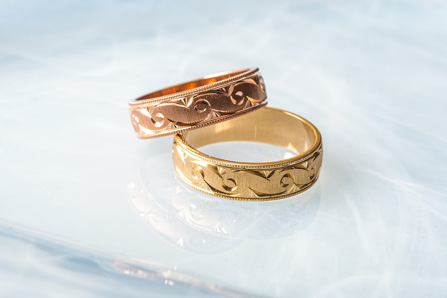 Rose Gold and Yellow Gold Wedding Rings on White Background