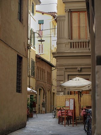Narrow European Street with Outdoor Cafe and Architecture