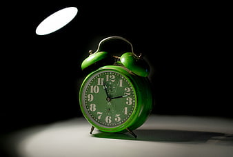 Vintage Green Alarm Clock in Spotlight
