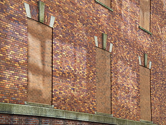 Textured Brick Wall with Filled Windows and Stone Details