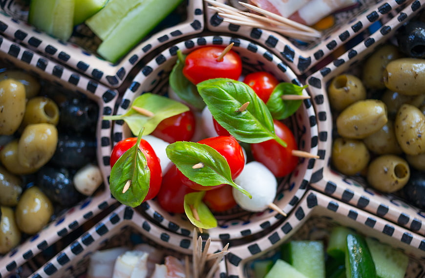 Italian antipasto platter with caprese skewers and olives