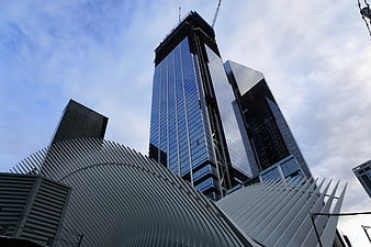 Low Angle View of Modern Skyscrapers and White Ribbed Architecture