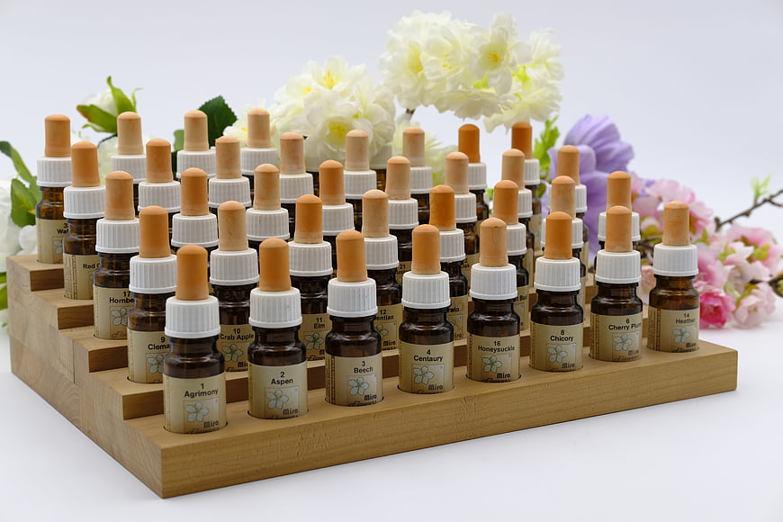 Bach Flower Remedy Vials Arranged in Wooden Display Stand