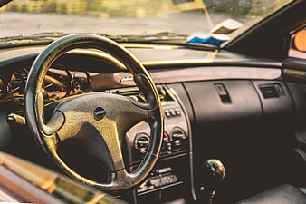 Vintage Car Interior with Steering Wheel and Dashboard