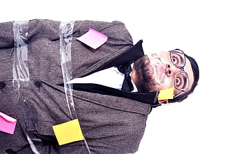 Man in Suit Taped to Surface with Sticky Notes