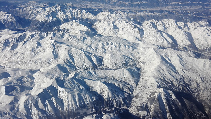 Aerial view of snow-covered mountain range in winter